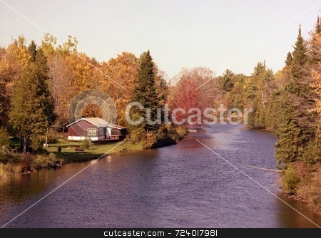 To use this stock image in your creative project, please select the size you need over to the right and click the "Add to Cart" button.
Your downloaded image will come with the Cutcaster watermark removed so don’t worry about the watermark you see on this page. Quiet Retreat stock photo, Image of small river and cottage in Haliburton Highlands, Ontario, Canada. It was photographed in the Fall. by Ray Carpenter
