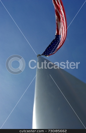 To use this stock image in your creative project, please select the size you need over to the right and click the "Add to Cart" button.
Your downloaded image will come with the Cutcaster watermark removed so don’t worry about the watermark you see on this page. American Flag On An Aluminum Flagpole stock photo, A unique view of a large American flag flying from the top of an aluminim flagpole. by Lynn Bendickson