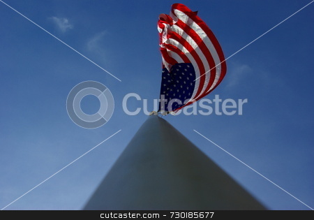 To use this stock image in your creative project, please select the size you need over to the right and click the "Add to Cart" button.
Your downloaded image will come with the Cutcaster watermark removed so don’t worry about the watermark you see on this page. American Flag On An Aluminum Flagpole stock photo, A unique view of a large American flag flying from the top of an aluminim flagpole. by Lynn Bendickson