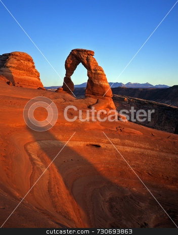 To use this stock image in your creative project, please select the size you need over to the right and click the "Add to Cart" button.
Your downloaded image will come with the Cutcaster watermark removed so don’t worry about the watermark you see on this page. Delicate Arch stock photo, Delicate Arch in Arches National Park, Utah. by Mike Norton