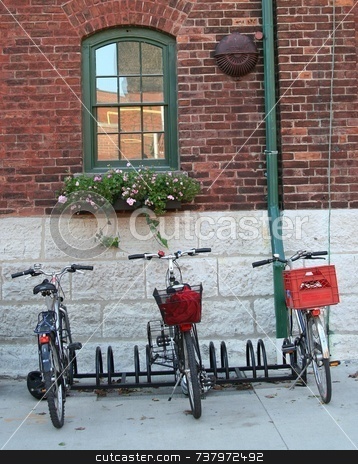 To use this stock image in your creative project, please select the size you need over to the right and click the "Add to Cart" button.
Your downloaded image will come with the Cutcaster watermark removed so don’t worry about the watermark you see on this page. Three Bicycles parked by a brick wall stock photo, Three bicycles, two with red luggage carriers parked by old-fashioned brick wall with window with green paint and flower box. by Wes Shepherd