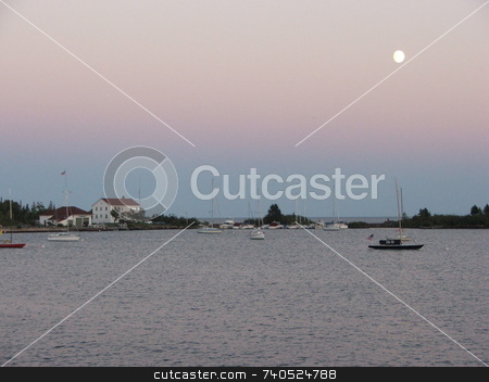 To use this stock image in your creative project, please select the size you need over to the right and click the "Add to Cart" button.
Your downloaded image will come with the Cutcaster watermark removed so don’t worry about the watermark you see on this page. Moon Over Grand Marais stock photo, An August moon hangs over the Grand Marais, Minnesota harbor. by Dennis Thomsen