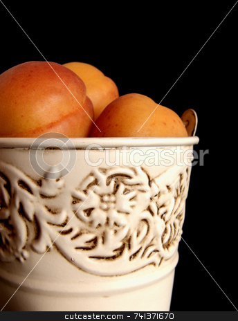 To use this stock image in your creative project, please select the size you need over to the right and click the "Add to Cart" button.
Your downloaded image will come with the Cutcaster watermark removed so don’t worry about the watermark you see on this page. Apricots in Tin Bucket stock photo, Fresh apricots in a rustic tin bucket, against a black background by Martie Venter