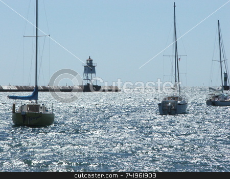 To use this stock image in your creative project, please select the size you need over to the right and click the "Add to Cart" button.
Your downloaded image will come with the Cutcaster watermark removed so don’t worry about the watermark you see on this page. Grand Marais Harbor stock photo, Sunlight sparkles on the water of the Grand Marais, Minnesota harbor where three sailboats are at anchor. Grand Marais is a popular tourist destination on Lake Superior's north shore. by Dennis Thomsen