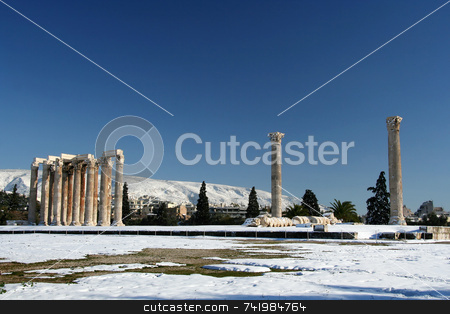 To use this stock image in your creative project, please select the size you need over to the right and click the "Add to Cart" button.
Your downloaded image will come with the Cutcaster watermark removed so don’t worry about the watermark you see on this page. Olympius Zeus Temple in Winter stock photo, The ancient temple of Olympian Zeus in Athens, Greece, after a snowfall by Georgios Alexandris