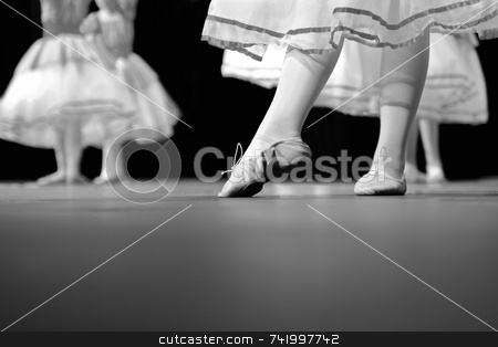 To use this stock image in your creative project, please select the size you need over to the right and click the "Add to Cart" button.
Your downloaded image will come with the Cutcaster watermark removed so don’t worry about the watermark you see on this page. Dance Recital in black and white stock photo, Dancers on stage during a recital. Originally shot in Black and White. Noise reduction was applied on the floor and the dancers in the background but not the foreground dancer. by Mitch Aunger
