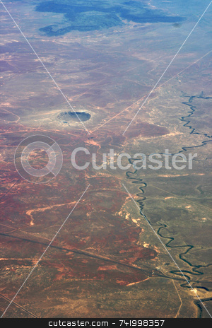 To use this stock image in your creative project, please select the size you need over to the right and click the "Add to Cart" button.
Your downloaded image will come with the Cutcaster watermark removed so don’t worry about the watermark you see on this page. Meteor Crater in Arizona stock photo, Taken from an airplane, the meteor crater in Arizona is very easy to see. by Mitch Aunger