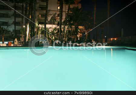 To use this stock image in your creative project, please select the size you need over to the right and click the "Add to Cart" button.
Your downloaded image will come with the Cutcaster watermark removed so don’t worry about the watermark you see on this page. Evening at the hotel pool stock photo, The pool at a hotel lit up at night... plenty of copyspace by Mitch Aunger