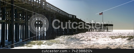 To use this stock image in your creative project, please select the size you need over to the right and click the "Add to Cart" button.
Your downloaded image will come with the Cutcaster watermark removed so don’t worry about the watermark you see on this page. Ventura Pier stock photo, The Ventura Pier with waves and the flag at the end. by Henrik Lehnerer