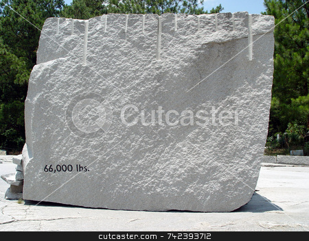 To use this stock image in your creative project, please select the size you need over to the right and click the "Add to Cart" button.
Your downloaded image will come with the Cutcaster watermark removed so don’t worry about the watermark you see on this page. Granite stock photo, 66,000 lbs of granite used to make headstones by Jack Schiffer
