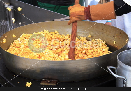 To use this stock image in your creative project, please select the size you need over to the right and click the "Add to Cart" button.
Your downloaded image will come with the Cutcaster watermark removed so don’t worry about the watermark you see on this page. Stirring popcorn stock photo, Popcorn corn ready to eat by Jack Schiffer