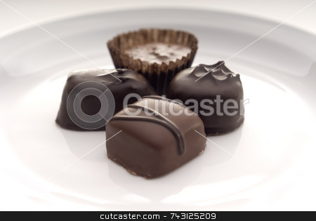 To use this stock image in your creative project, please select the size you need over to the right and click the "Add to Cart" button.
Your downloaded image will come with the Cutcaster watermark removed so don’t worry about the watermark you see on this page. Close up of chocolates on a white plate stock photo, A closeup of some chocolates on a white plate.
Suitable for Valentines Day topics, birthday topics, anniversary topics by Vince Clements