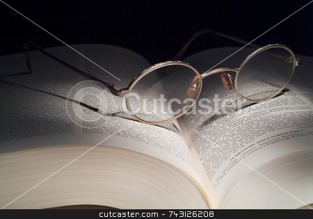 To use this stock image in your creative project, please select the size you need over to the right and click the "Add to Cart" button.
Your downloaded image will come with the Cutcaster watermark removed so don’t worry about the watermark you see on this page. Reading Glasses on book stock photo, Reading glasses on large book. Lighting is painting with light. by Vince Clements