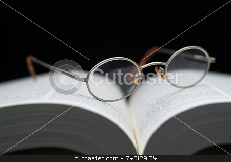 To use this stock image in your creative project, please select the size you need over to the right and click the "Add to Cart" button.
Your downloaded image will come with the Cutcaster watermark removed so don’t worry about the watermark you see on this page. Closeup of reading glasses on large book stock photo, Closeup of reading glasses on large book shallow focus by Vince Clements