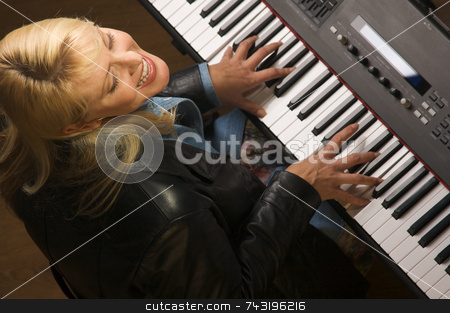 To use this stock image in your creative project, please select the size you need over to the right and click the "Add to Cart" button.
Your downloaded image will come with the Cutcaster watermark removed so don’t worry about the watermark you see on this page. Femal Musician Performs stock photo, Femal Musician Sings While Playing Digital Piano by Andy Dean