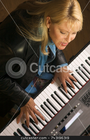 To use this stock image in your creative project, please select the size you need over to the right and click the "Add to Cart" button.
Your downloaded image will come with the Cutcaster watermark removed so don’t worry about the watermark you see on this page. Femal Musician Performs stock photo, Femal Musician Sings While Playing Digital Piano by Andy Dean