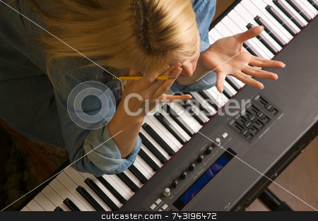 To use this stock image in your creative project, please select the size you need over to the right and click the "Add to Cart" button.
Your downloaded image will come with the Cutcaster watermark removed so don’t worry about the watermark you see on this page. Creative Frustration stock photo, Woman Shows Signs of Creative Frustration by Andy Dean