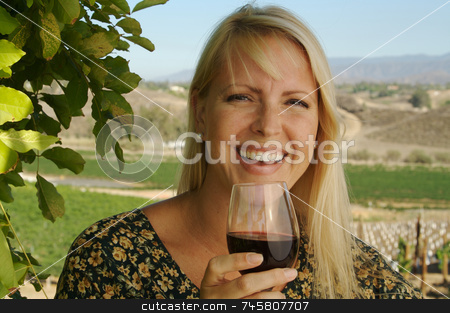 To use this stock image in your creative project, please select the size you need over to the right and click the "Add to Cart" button.
Your downloaded image will come with the Cutcaster watermark removed so don’t worry about the watermark you see on this page. Attractive Woman Sips Wine stock photo, Attractive Woman Sips Wine at a Winery in the country. by Andy Dean