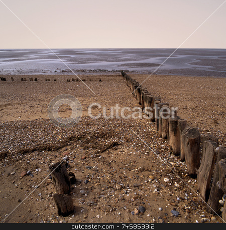 To use this stock image in your creative project, please select the size you need over to the right and click the "Add to Cart" button.
Your downloaded image will come with the Cutcaster watermark removed so don’t worry about the watermark you see on this page. Erosion stock photo, Worn sea defences jutting out into sea by Paul Phillips