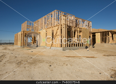 To use this stock image in your creative project, please select the size you need over to the right and click the "Add to Cart" button.
Your downloaded image will come with the Cutcaster watermark removed so don’t worry about the watermark you see on this page. Construction Home Framing Abstract stock photo, New residential construction home framing site. by Andy Dean