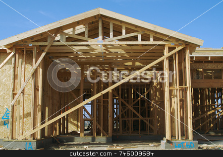 To use this stock image in your creative project, please select the size you need over to the right and click the "Add to Cart" button.
Your downloaded image will come with the Cutcaster watermark removed so don’t worry about the watermark you see on this page. Construction Home Framing Abstract stock photo, New residential construction home framing site. by Andy Dean