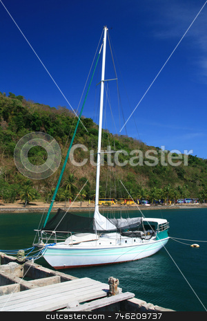 To use this stock image in your creative project, please select the size you need over to the right and click the "Add to Cart" button.
Your downloaded image will come with the Cutcaster watermark removed so don’t worry about the watermark you see on this page. Sail boat stock photo, Sail boat docked at a pier of a resort by Jonas Marcos San Luis
