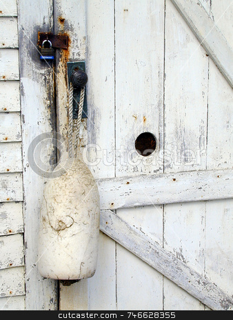 To use this stock image in your creative project, please select the size you need over to the right and click the "Add to Cart" button.
Your downloaded image will come with the Cutcaster watermark removed so don’t worry about the watermark you see on this page. White Buoy stock photo, A single white buoy, hanging at a doorway of an old white building by Tom and Beth Pulsipher