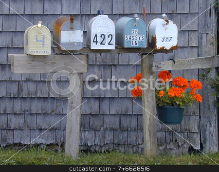 To use this stock image in your creative project, please select the size you need over to the right and click the "Add to Cart" button.
Your downloaded image will come with the Cutcaster watermark removed so don’t worry about the watermark you see on this page. Mailboxes and Geranium stock photo, A row of mailboxes along a rural road, decorated with a hanging geranium by Tom and Beth Pulsipher
