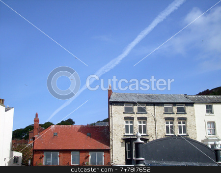 To use this stock image in your creative project, please select the size you need over to the right and click the "Add to Cart" button.
Your downloaded image will come with the Cutcaster watermark removed so don’t worry about the watermark you see on this page. Airplane vapour trails in blue sky stock photo, Airplane vapour trails in blue sky over english seaside architecture. by Martin Crowdy