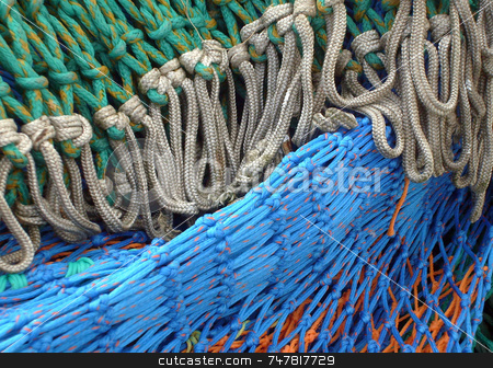 To use this stock image in your creative project, please select the size you need over to the right and click the "Add to Cart" button.
Your downloaded image will come with the Cutcaster watermark removed so don’t worry about the watermark you see on this page. Fishing nets stock photo, Fishing nets seen in close up detail. by Martin Crowdy