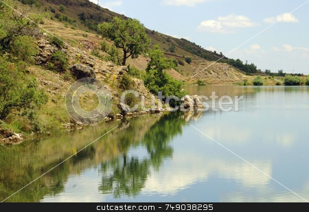 To use this stock image in your creative project, please select the size you need over to the right and click the "Add to Cart" button.
Your downloaded image will come with the Cutcaster watermark removed so don’t worry about the watermark you see on this page. Reflecting Clouds stock photo, Reflecting clouds in lake in anatolia turkey by Kobby Dagan