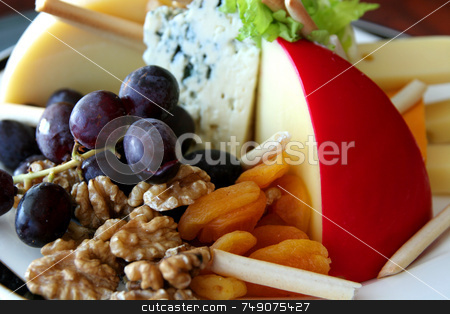 To use this stock image in your creative project, please select the size you need over to the right and click the "Add to Cart" button.
Your downloaded image will come with the Cutcaster watermark removed so don’t worry about the watermark you see on this page. Fruit, Nuts, and Cheese stock photo, A fruit, nut, and cheese tray in a buffet by Darryl Brooks