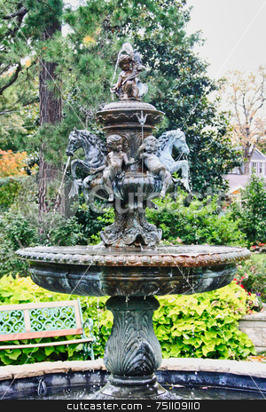 To use this stock image in your creative project, please select the size you need over to the right and click the "Add to Cart" button.
Your downloaded image will come with the Cutcaster watermark removed so don’t worry about the watermark you see on this page. Classic Fountain stock photo, A classic fountain captured in an old park by Kevin Tietz