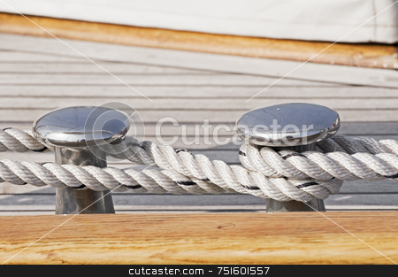 To use this stock image in your creative project, please select the size you need over to the right and click the "Add to Cart" button.
Your downloaded image will come with the Cutcaster watermark removed so don’t worry about the watermark you see on this page. Moored boat stock photo, Close-up of rope securing a wooden boat to dock by Massimiliano Leban