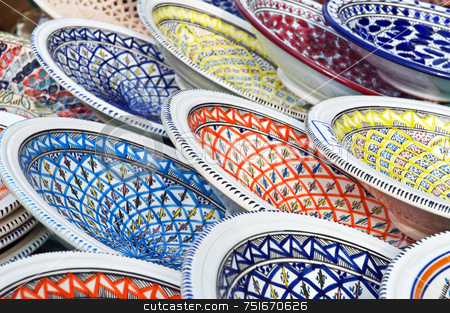 To use this stock image in your creative project, please select the size you need over to the right and click the "Add to Cart" button.
Your downloaded image will come with the Cutcaster watermark removed so don’t worry about the watermark you see on this page. Painted dishes stock photo, Typical handmade coloured dishes displayed in an exhibition by Massimiliano Leban