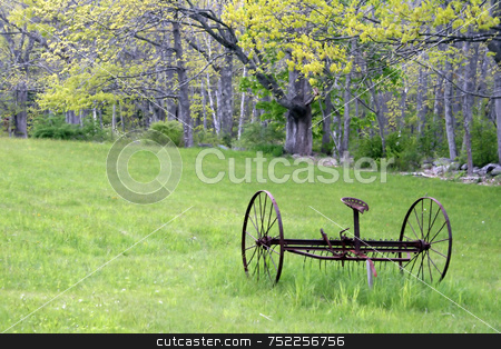 To use this stock image in your creative project, please select the size you need over to the right and click the "Add to Cart" button.
Your downloaded image will come with the Cutcaster watermark removed so don’t worry about the watermark you see on this page. Old Hay Rake in Spring stock photo, In a rural field, an antique hay rake lies rusting on a beautiful Spring day by Tom and Beth Pulsipher