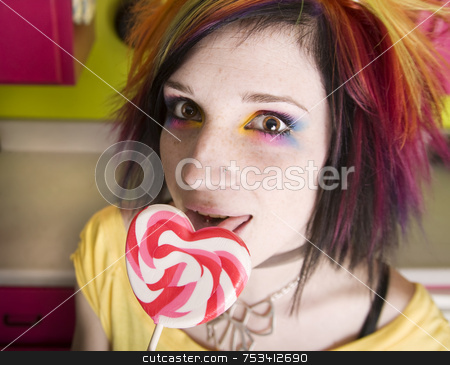 To use this stock image in your creative project, please select the size you need over to the right and click the "Add to Cart" button.
Your downloaded image will come with the Cutcaster watermark removed so don’t worry about the watermark you see on this page. Alternative Girl with a Heart Lollipop stock photo, Alternative Girl in a Colorful Kitchen with a Heart Lollipop by Scott Griessel