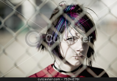 To use this stock image in your creative project, please select the size you need over to the right and click the "Add to Cart" button.
Your downloaded image will come with the Cutcaster watermark removed so don’t worry about the watermark you see on this page. Punk Girl Behind Chain Link stock photo, Young Punk Girl Being Shadowed By Chain Link by Scott Griessel