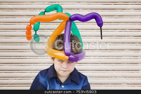 To use this stock image in your creative project, please select the size you need over to the right and click the "Add to Cart" button.
Your downloaded image will come with the Cutcaster watermark removed so don’t worry about the watermark you see on this page. Mad Boy with a Balloon Hat stock photo, Young boy wearing a balloon hat with an angry face by Scott Griessel