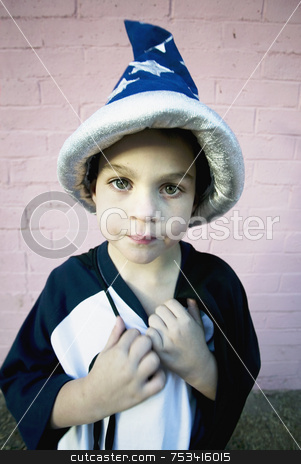 To use this stock image in your creative project, please select the size you need over to the right and click the "Add to Cart" button.
Your downloaded image will come with the Cutcaster watermark removed so don’t worry about the watermark you see on this page. Wizard Boy stock photo, Young boy in a wizard costume pulling at his string tie by Scott Griessel