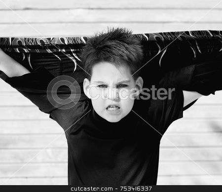 To use this stock image in your creative project, please select the size you need over to the right and click the "Add to Cart" button.
Your downloaded image will come with the Cutcaster watermark removed so don’t worry about the watermark you see on this page. Boy with his shirt behind his head stock photo, Young boy with his shirt stretched behind his head and a scary look on his face. by Scott Griessel