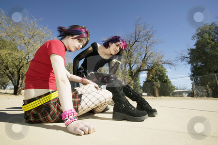 To use this stock image in your creative project, please select the size you need over to the right and click the "Add to Cart" button.
Your downloaded image will come with the Cutcaster watermark removed so don’t worry about the watermark you see on this page. Two Punk Girls stock photo, Two Punk Girls Sitting on a cement playground by Scott Griessel