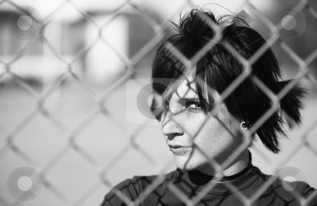 To use this stock image in your creative project, please select the size you need over to the right and click the "Add to Cart" button.
Your downloaded image will come with the Cutcaster watermark removed so don’t worry about the watermark you see on this page. Punk Girl Behind Chain Link stock photo, Young Punk Girl Being Shadowed By Chain Link by Scott Griessel