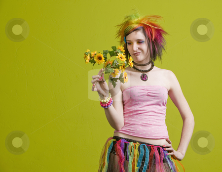 To use this stock image in your creative project, please select the size you need over to the right and click the "Add to Cart" button.
Your downloaded image will come with the Cutcaster watermark removed so don’t worry about the watermark you see on this page. Punk woman with plastic flowers stock photo, Pretty young woman with colorful punk clothes considers plastic flowers. by Scott Griessel