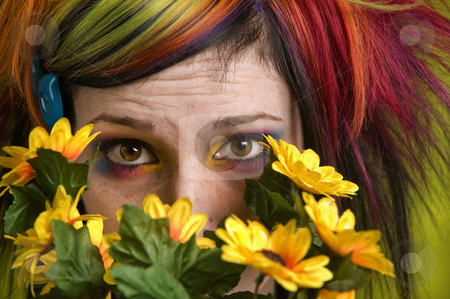 To use this stock image in your creative project, please select the size you need over to the right and click the "Add to Cart" button.
Your downloaded image will come with the Cutcaster watermark removed so don’t worry about the watermark you see on this page. Punk woman with plastic flowers stock photo, Pretty young woman peeks out from behind plastic flowers. by Scott Griessel