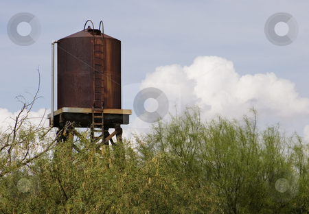 To use this stock image in your creative project, please select the size you need over to the right and click the "Add to Cart" button.
Your downloaded image will come with the Cutcaster watermark removed so don’t worry about the watermark you see on this page. Rusty Water Tower stock photo, Rusty water tower with a storm cloud in the background. by Scott Griessel