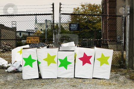 To use this stock image in your creative project, please select the size you need over to the right and click the "Add to Cart" button.
Your downloaded image will come with the Cutcaster watermark removed so don’t worry about the watermark you see on this page. Star Boxes stock photo, Trash boxes with brightly colored stars in front of a chain link fence. by Scott Griessel