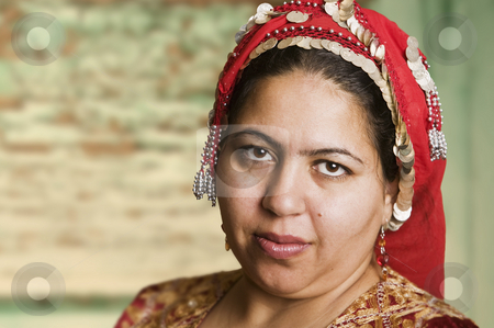 To use this stock image in your creative project, please select the size you need over to the right and click the "Add to Cart" button.
Your downloaded image will come with the Cutcaster watermark removed so don’t worry about the watermark you see on this page. Muslim Woman stock photo, Portrait of a Muslim Woman in an Ornate Head Scarf by Scott Griessel