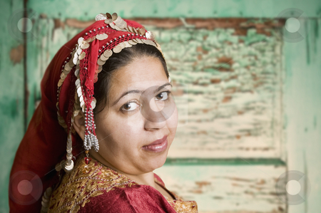 To use this stock image in your creative project, please select the size you need over to the right and click the "Add to Cart" button.
Your downloaded image will come with the Cutcaster watermark removed so don’t worry about the watermark you see on this page. Muslim Woman stock photo, Portrait of a Muslim Woman in an Ornate Head Scarf by Scott Griessel