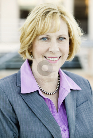 To use this stock image in your creative project, please select the size you need over to the right and click the "Add to Cart" button.
Your downloaded image will come with the Cutcaster watermark removed so don’t worry about the watermark you see on this page. Business Woman stock photo, Blonde Business Woman in a Purple Shirt and Grey Suit by Scott Griessel